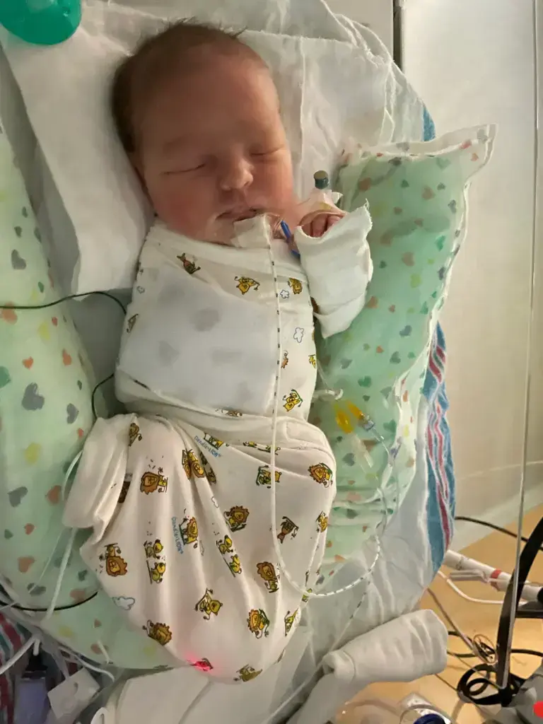 Too Late for the Hospital: My 37-Week Unplanned Home Birth and the Helicopter Ride to the NICU 15 Baby Wrangler after the CPAP was removed. She is resting, with the feeding tube still visible and in place.