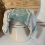 Sourdough crock with tea towel over it